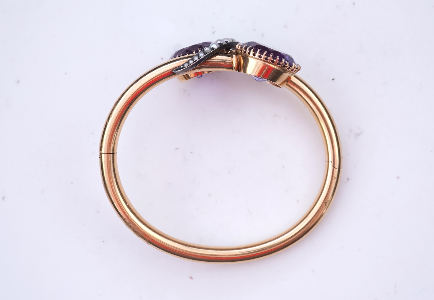 A Victorian gold, pearl and amethyst bangle, late 19th century